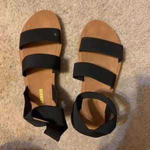 flat black slip-on sandals
